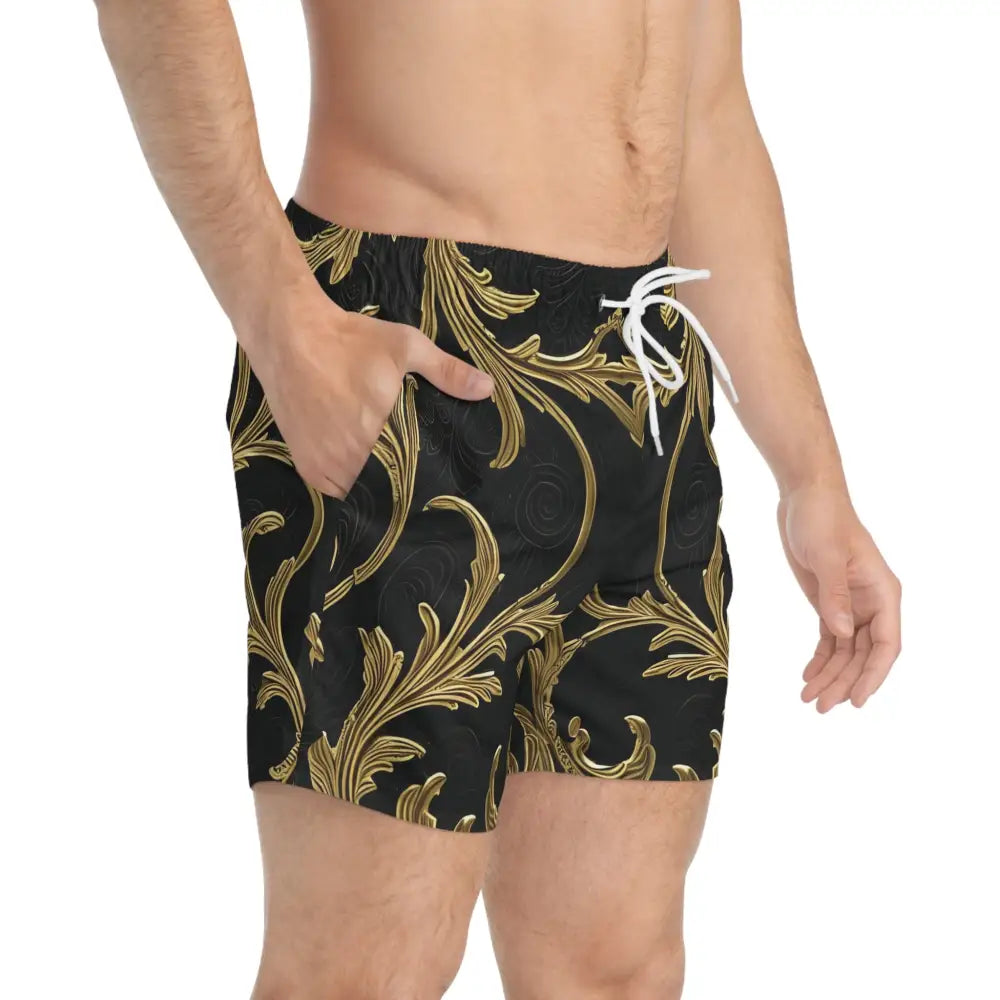 Patterned men’s swim trunks with gold flourish design from PixiOnyx Aesthetic Wear