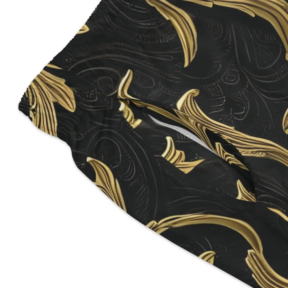 Black and gold patterned fabric shown on Baroque Gold Flourish Swim Trunks by PixiOnyx