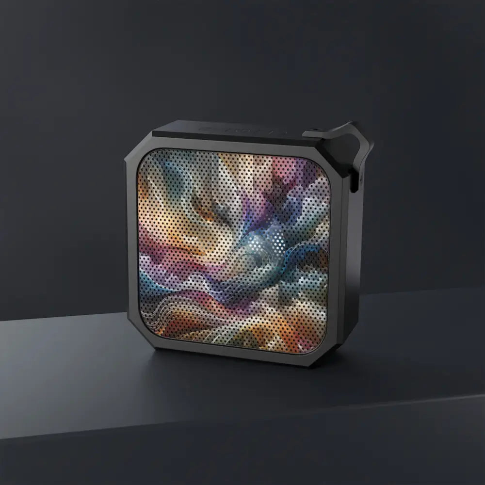 Square black Bluetooth speaker with colorful patterned grill for outdoor audio enjoyment