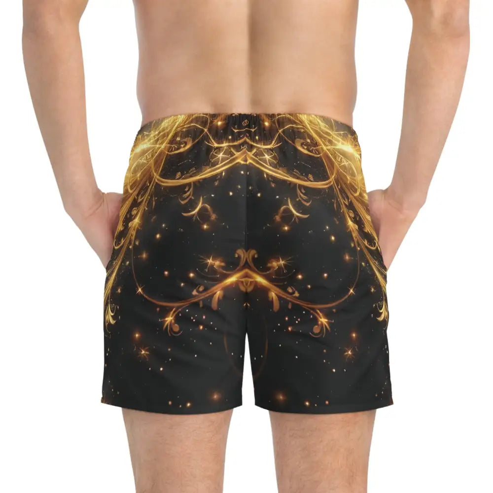Patterned swim trunks with ornate gold filigree design on black fabric