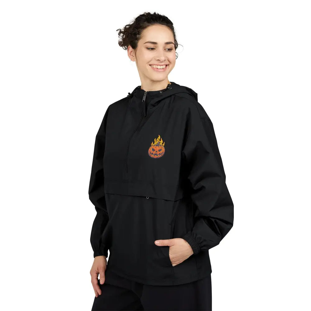 Black champion packable anorak jacket with flaming pumpkin and flame graphic for Halloween