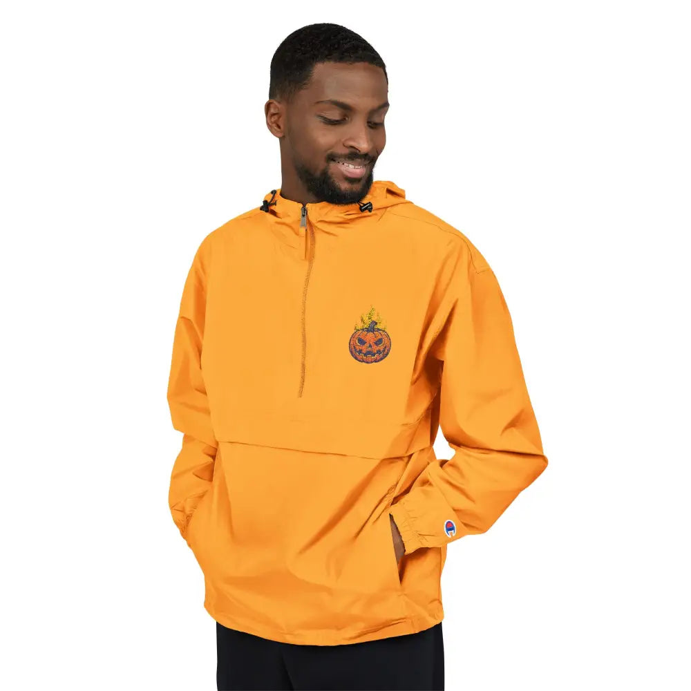 Men’s orange champion packable anorak jacket with flaming pumpkin graphic for Halloween streetwear