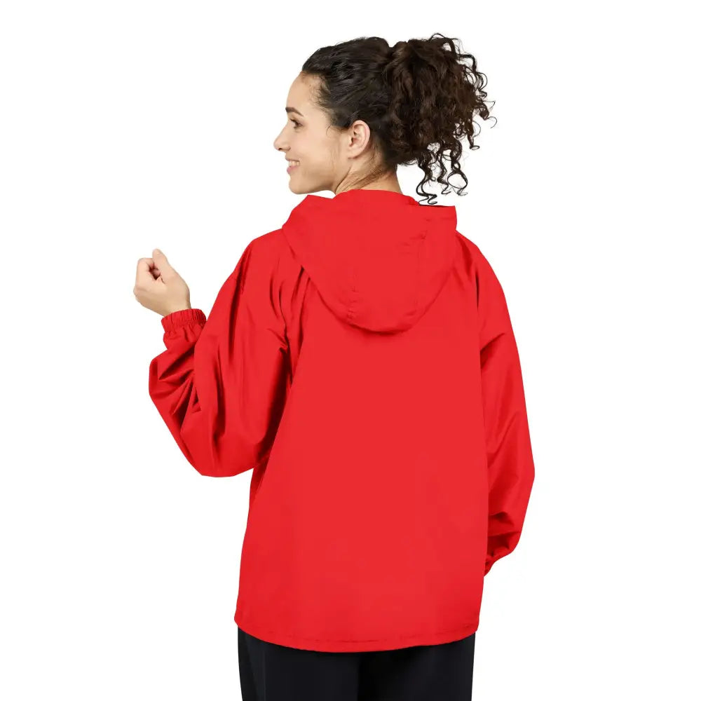 Woman in a red hooded champion packable anorak jacket with flaming pumpkin design