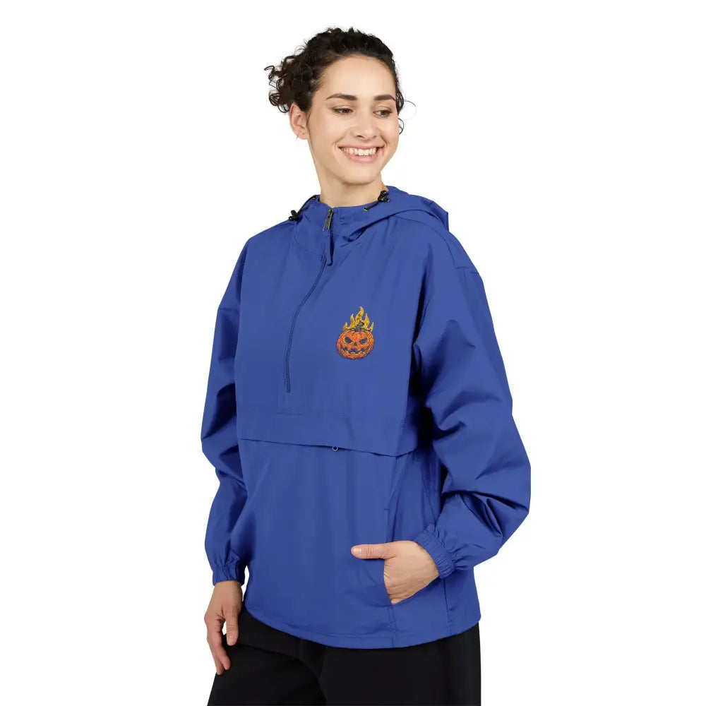 Woman wearing Champion Packable Anorak Jacket with flaming pumpkin graphic for Halloween style