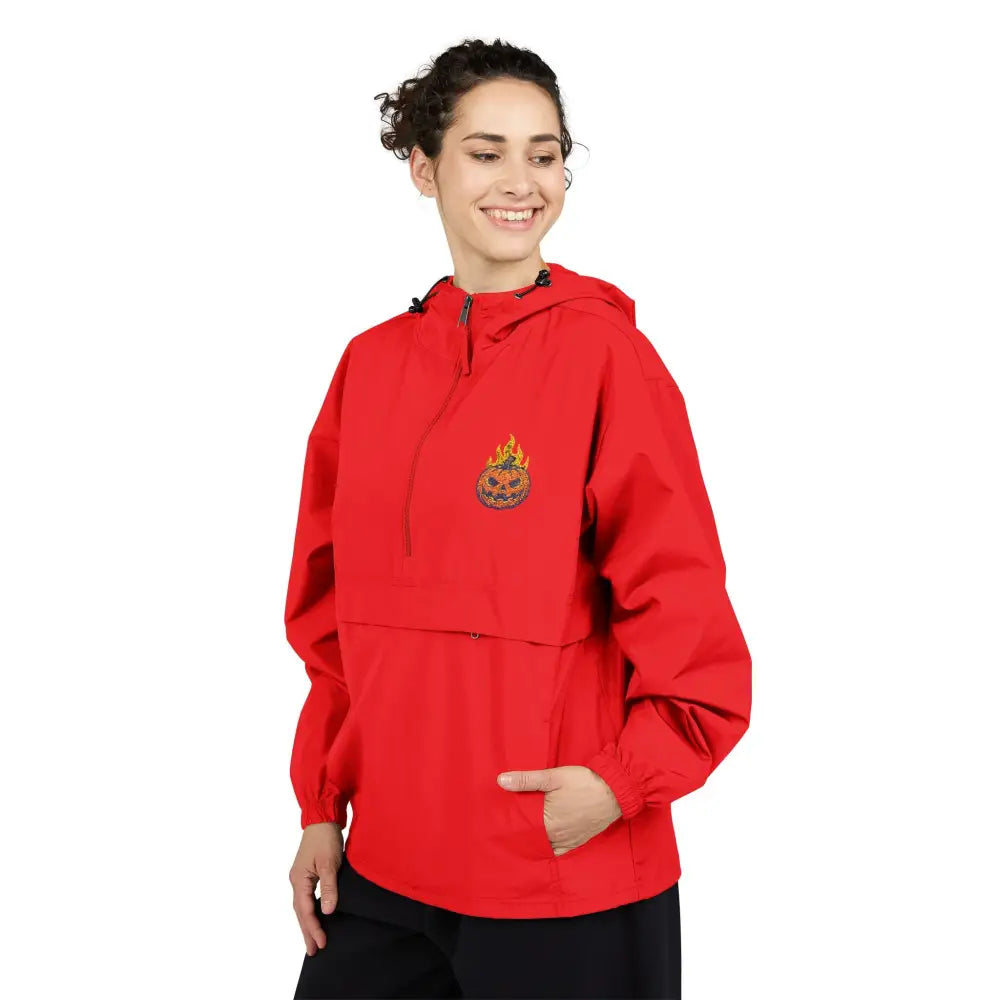 Women’s red Champion Packable Anorak with flaming pumpkin emblem, Halloween windbreaker