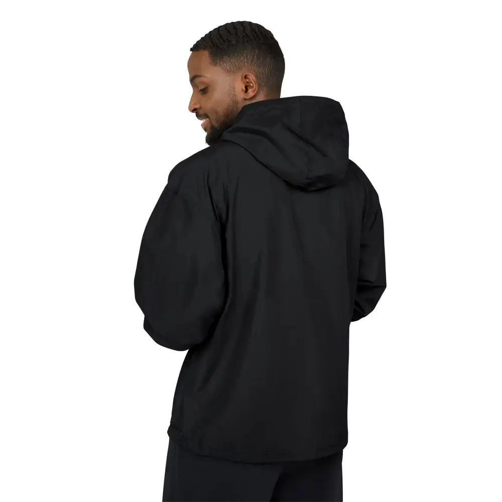 Man wearing Champion Packable Anorak Jacket in flaming pumpkin design, streetwear style