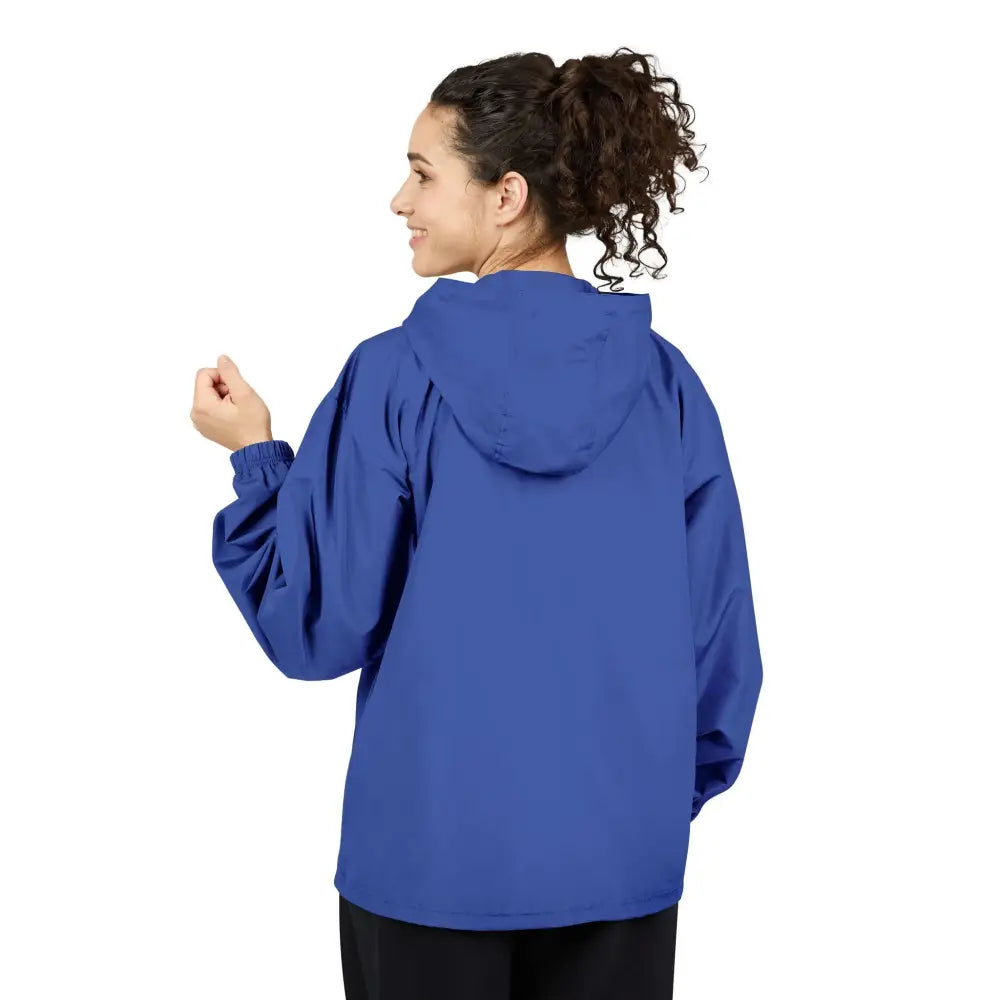 Woman in royal blue champion packable anorak jacket with hood and elastic cuffs