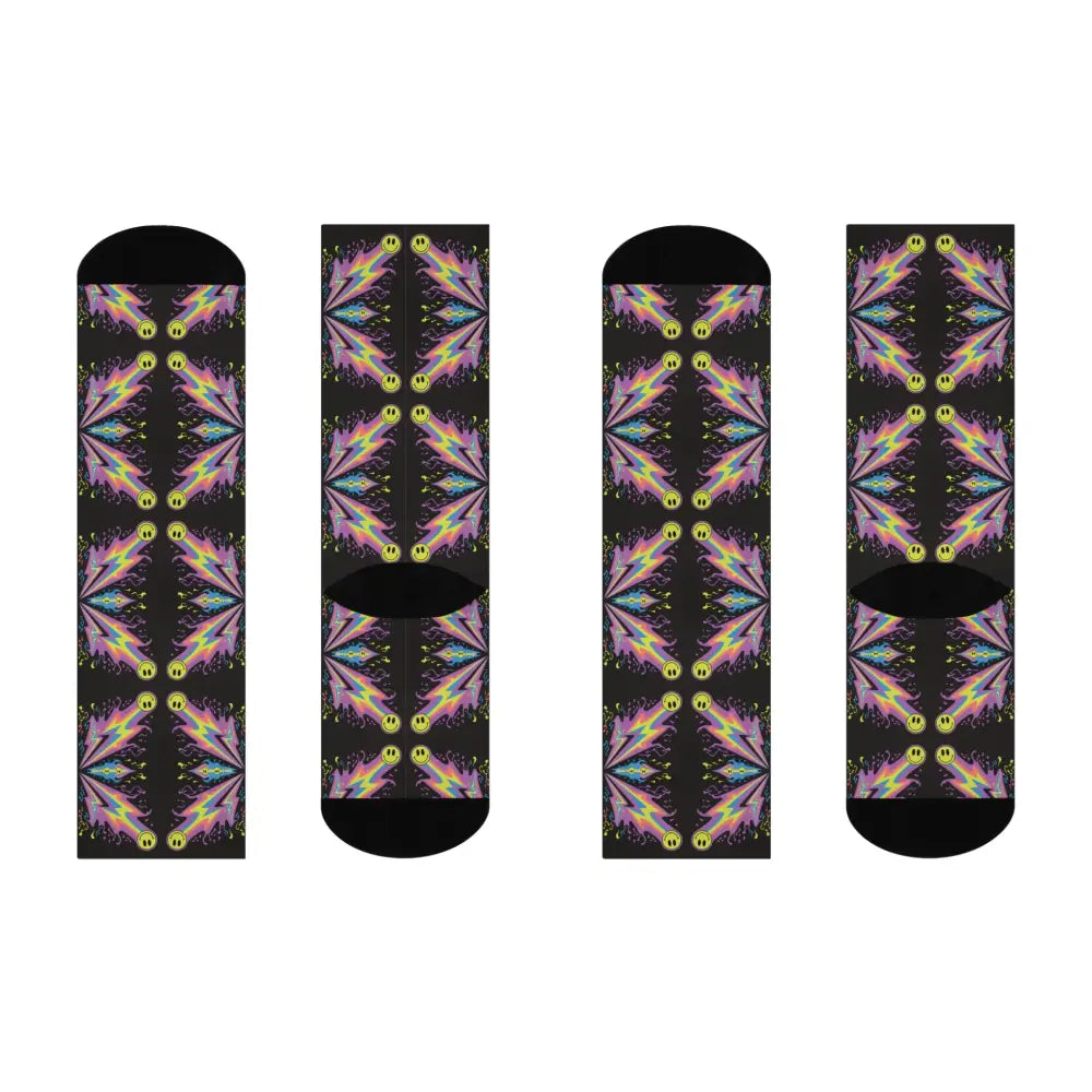 Four pairs of cushioned crew socks with neon smiley bolt and smiley bolt burst patterns