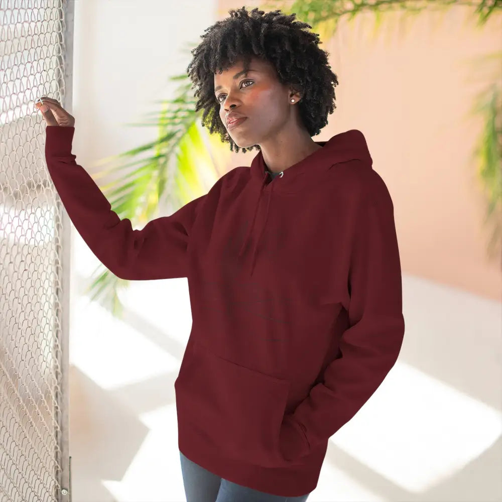 Woman in dark red three-panel fleece hoodie with spacious kangaroo pocket lane seven ls14001