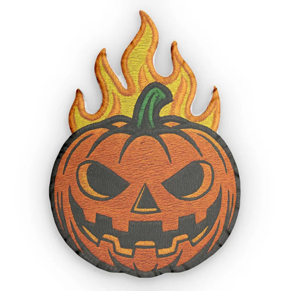 Embroidered flaming pumpkin patch on pumpkin shaped pillow for Halloween decor