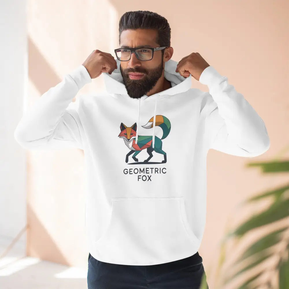 Man modeling white hoodie with colorful geometric fox design, machine wash max 30c, low heat