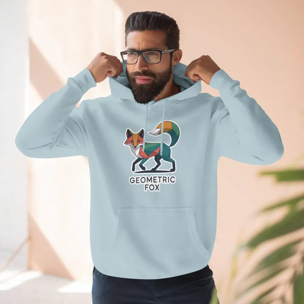 Light blue hoodie with colorful geometric fox design, machine washable at max 30c, cozy outdoor wear