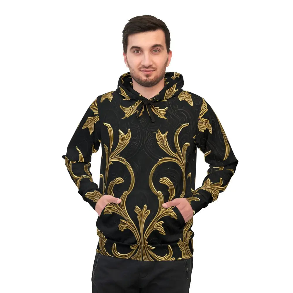 Man wearing a black and gold patterned Gilded Veil Hoodie with elegant Baroque design