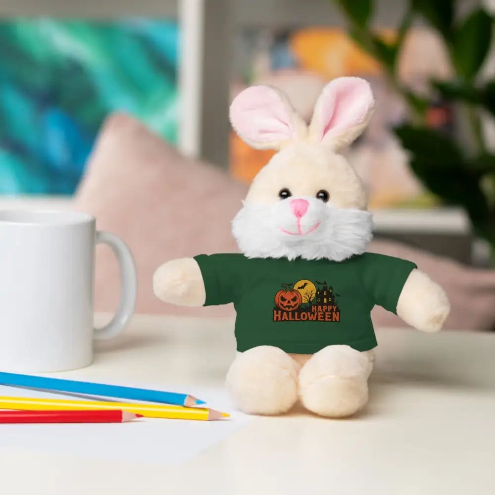 Cream-colored bunny plush toy wearing a dark green haunted house Halloween T-shirt, collectible plush