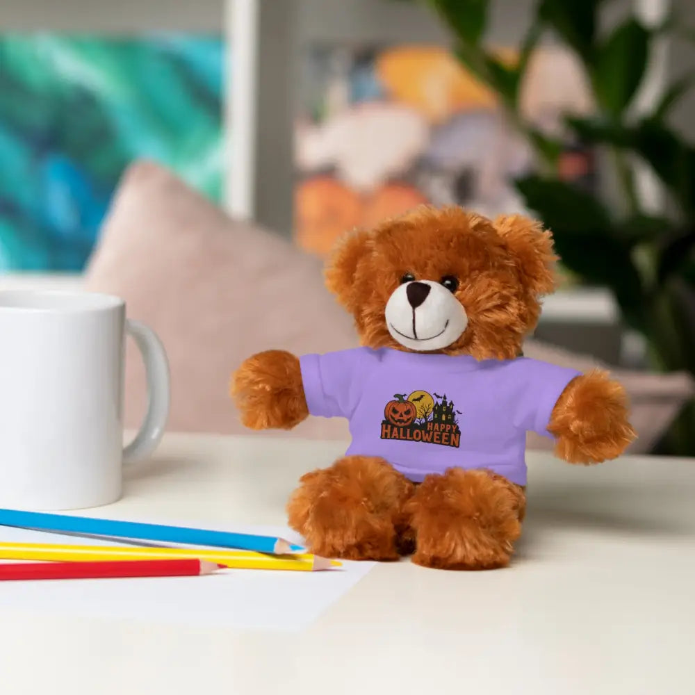 Brown teddy bear wearing lavender Halloween T-shirt with haunted house graphic, collectible plush