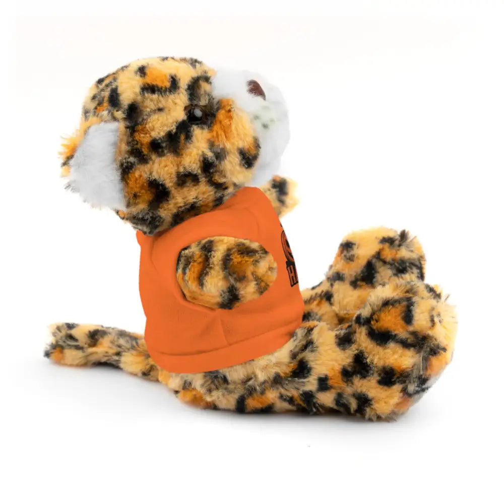 Leopard print plush toy wearing orange tee featuring haunted house design, collectible stuffed animal
