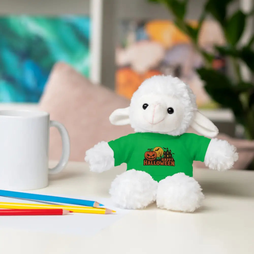 White lamb plush toy wearing a green haunted house themed tee, collectible stuffed animal