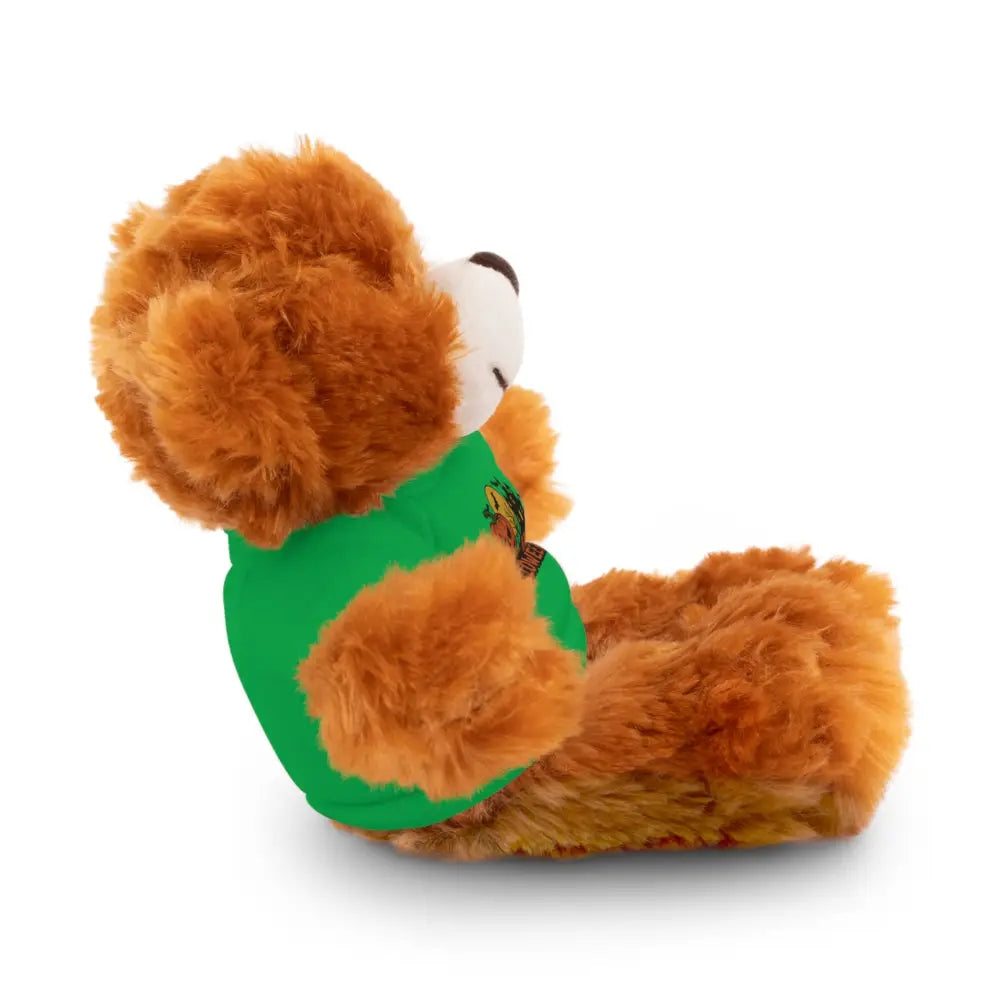Fluffy brown teddy bear wearing a green T-shirt with haunted house design, collectible plush