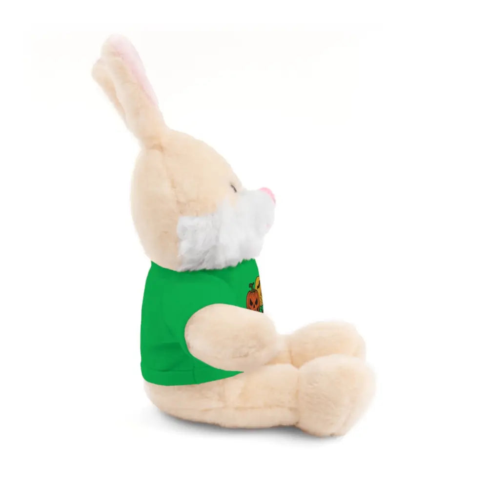 Cream-colored plush bunny wearing a green haunted house themed tee, collectible plush toy