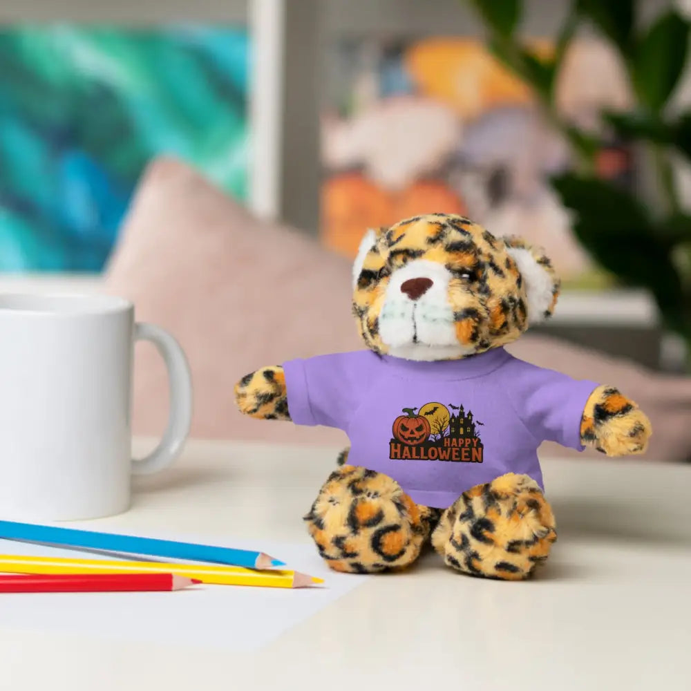 Plush leopard toy wearing purple Halloween shirt with haunted house graphic collectible plush