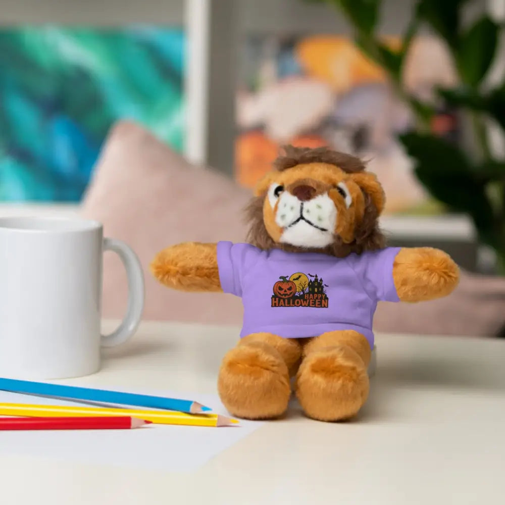 Plush lion toy wearing purple Halloween t-shirt with haunted house graphic, collectible plush
