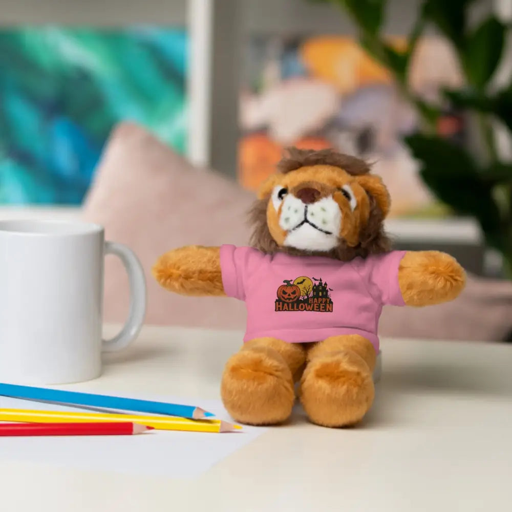 Plush lion toy wearing pink Halloween T-shirt, haunted house design, collectible plush