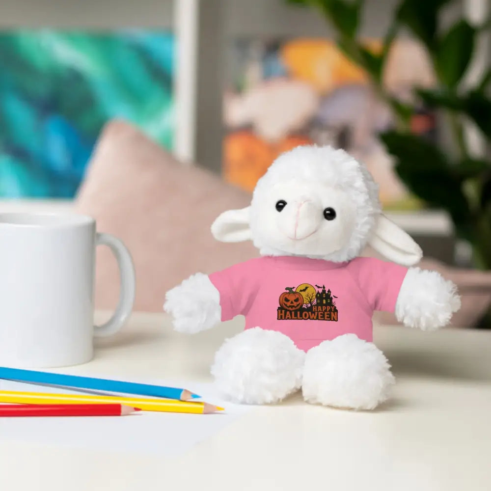 White lamb plush toy with Halloween haunted house graphic wearing pink tee collectible stuffed animal