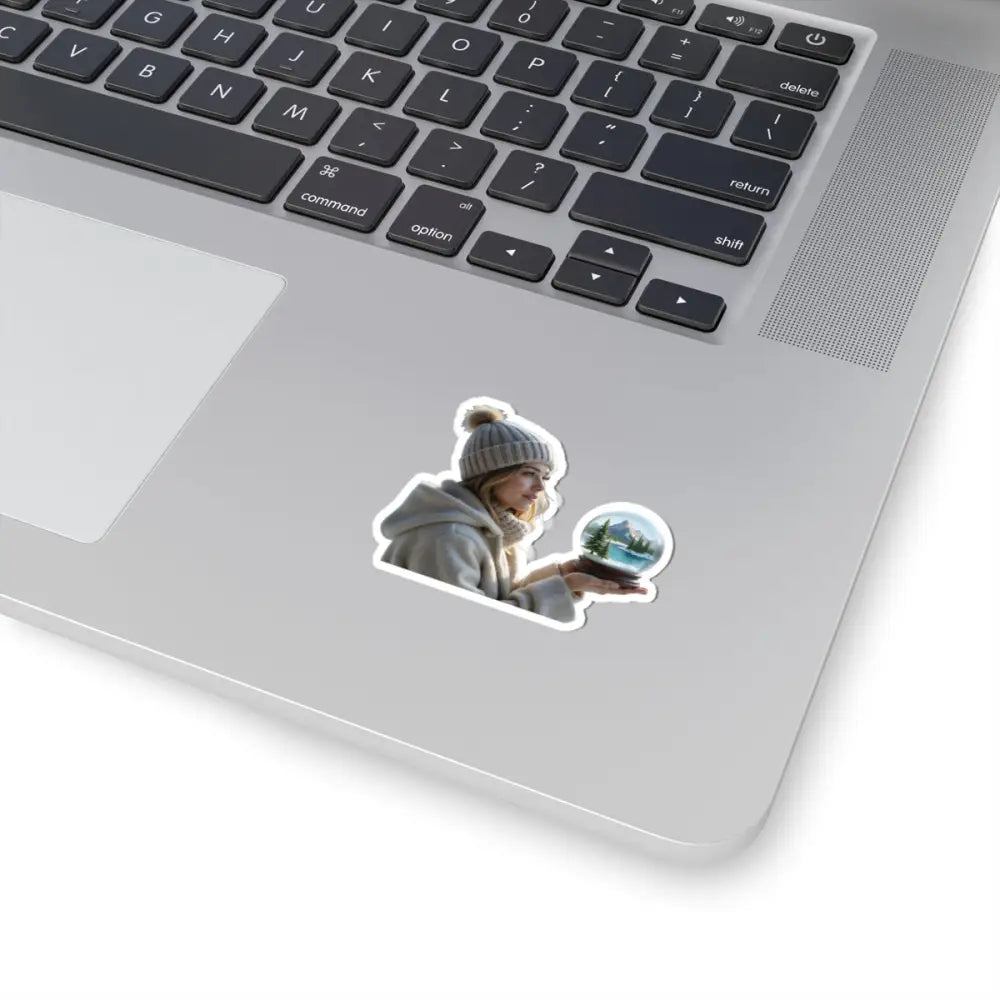 Laptop sticker of a woman holding a snow globe from PixiOnyx Winter Wonder series