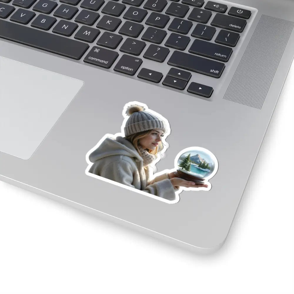 Laptop sticker featuring a woman holding a snow globe from PixiOnyx Winter Wonder series