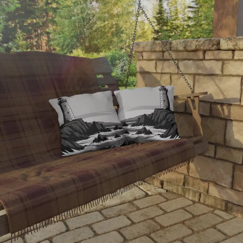 Wooden porch swing with vibrant color lighthouse outdoor pillows and a plaid blanket