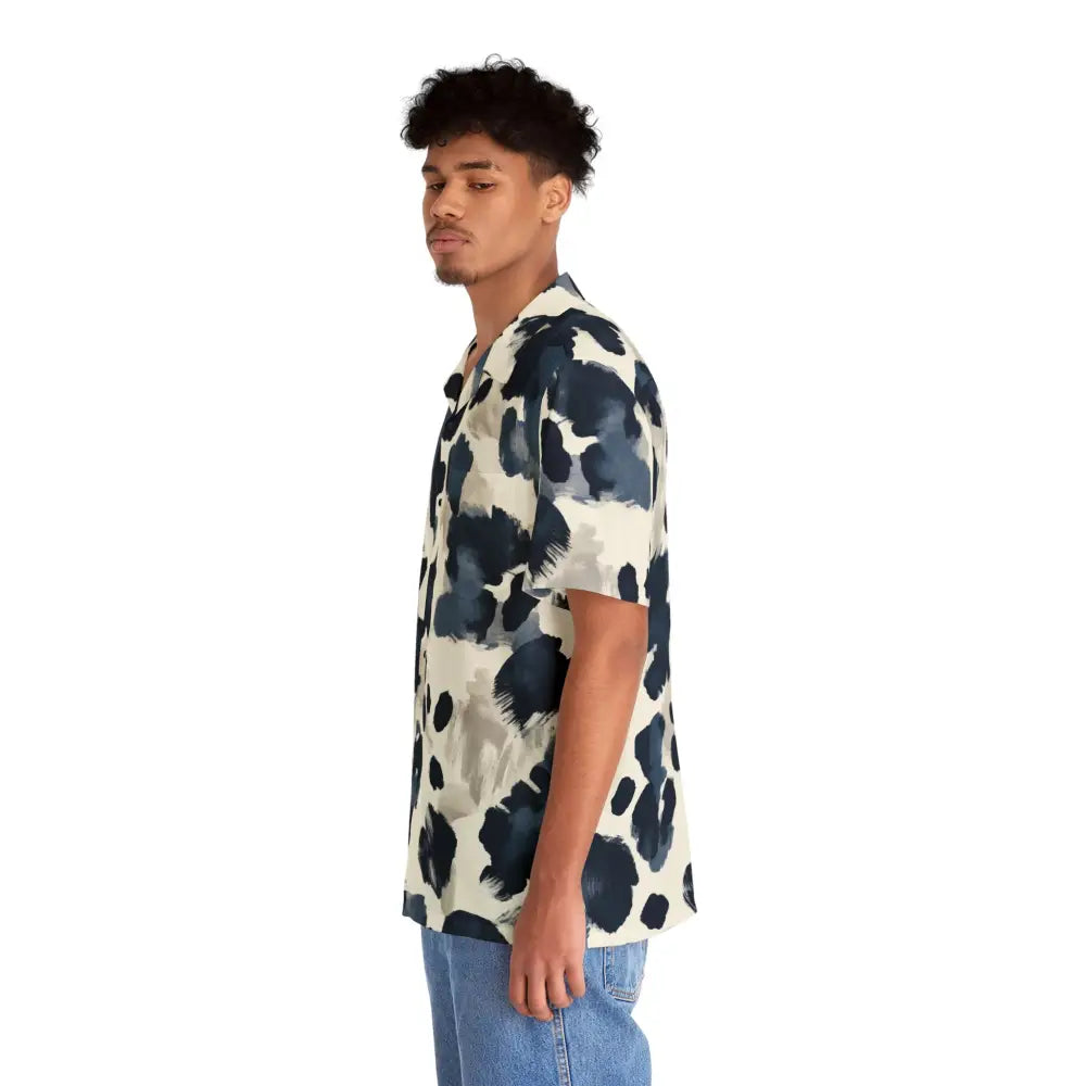 Man wearing a patterned short-sleeved Hawaiian shirt and jeans for PixiOnyx Surreal Summerwear