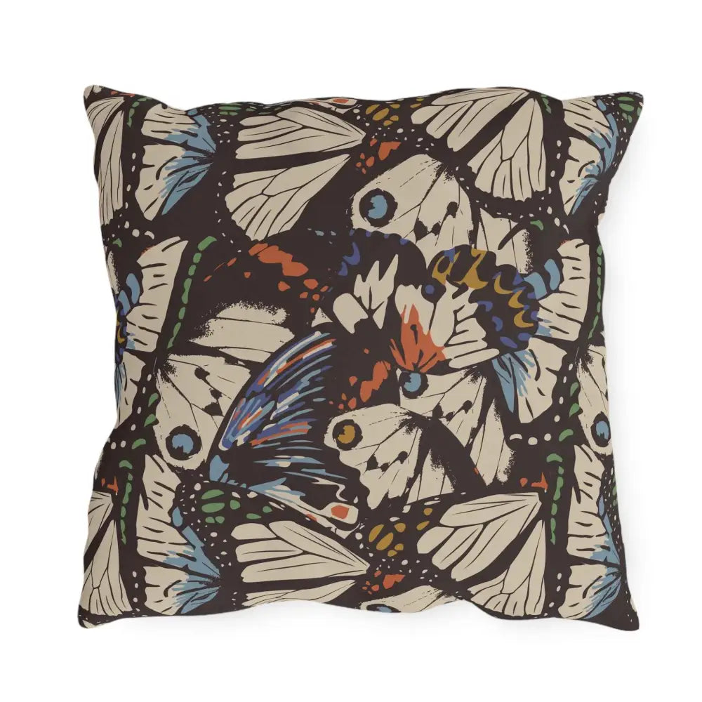 Dark decorative throw pillow with vibrant butterfly wing pattern for outdoor lounge space