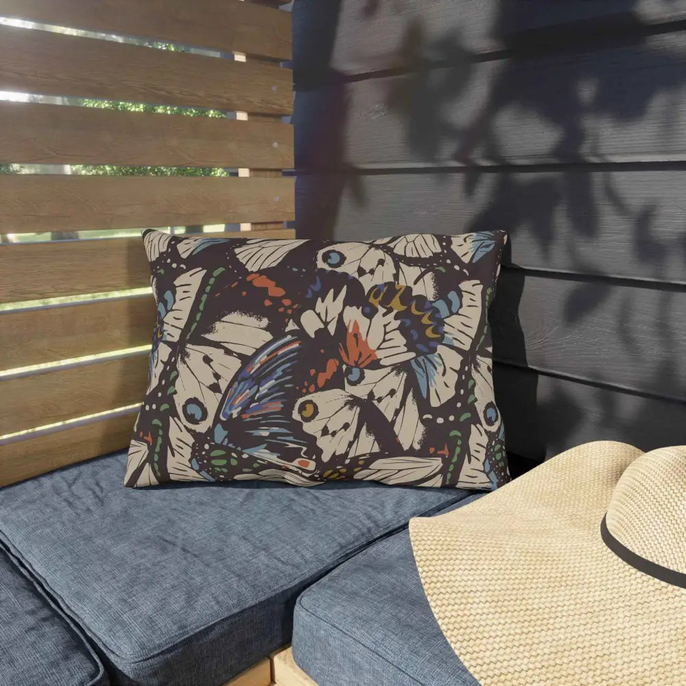 Outdoor lounge space pillow featuring a bohemian butterfly pattern by Honson Ventures Limited