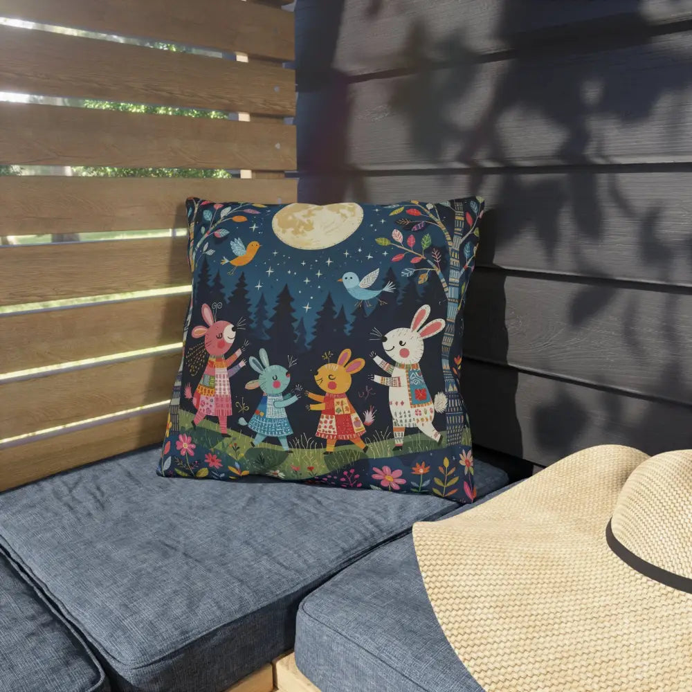 Decorative outdoor cushion with cartoon rabbits dancing under a full moon for woodland picnic nook