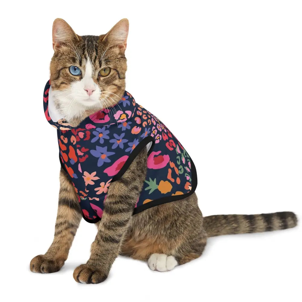 Tabby cat wearing a colorful floral and animal print pet hoodie from PixiOnyx Bold Petwear