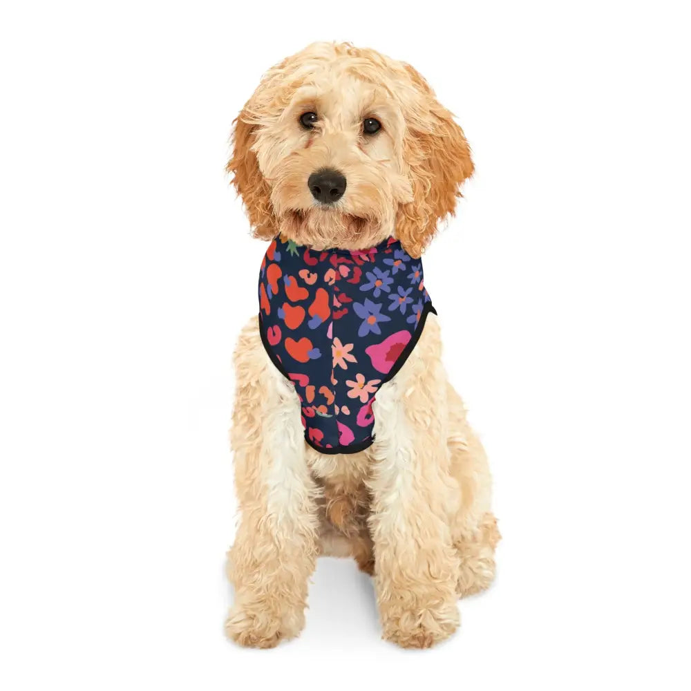 Dog wearing a colorful floral and heart-patterned harness from PixiOnyx Bold Petwear