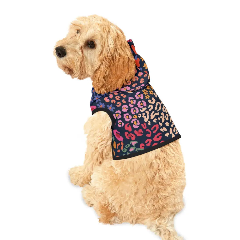 Dog wearing a colorful floral hooded sweatshirt from PixiOnyx Bold Petwear