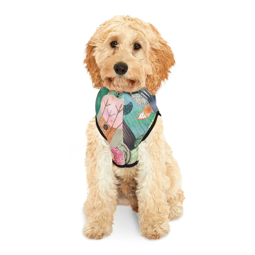 Golden Doodle wearing a colorful woodland camo patterned dog harness from PixiOnyx Bold Petwear