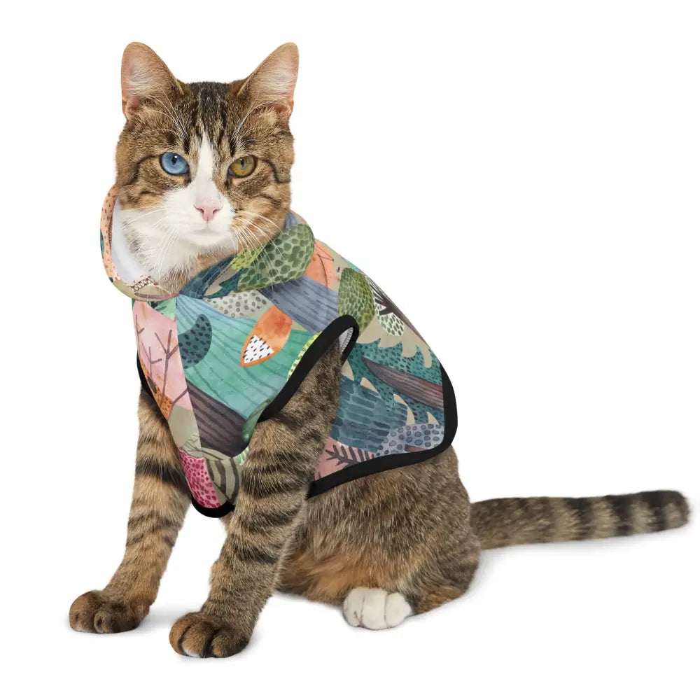 Tabby cat wearing a colorful woodland camo hoodie from PixiOnyx Bold Petwear