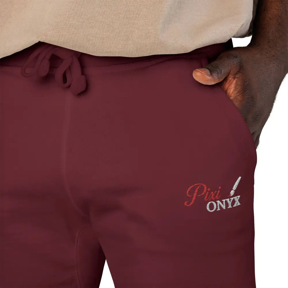 Maroon PixiOnyx Cozy Unisex fleece sweatpants with logo, perfect for relaxation and travel