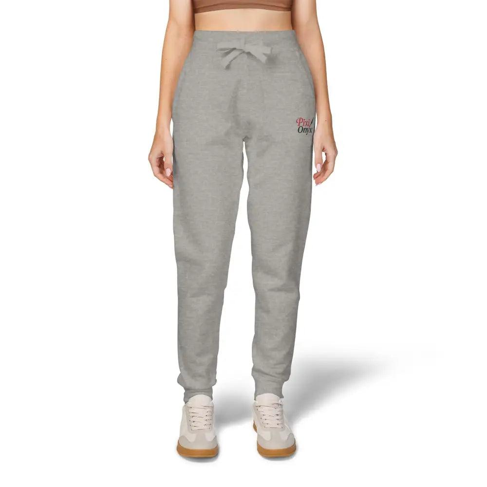 Light gray unisex fleece sweatpants with pink embroidered logo for cozy relaxation and casual wear