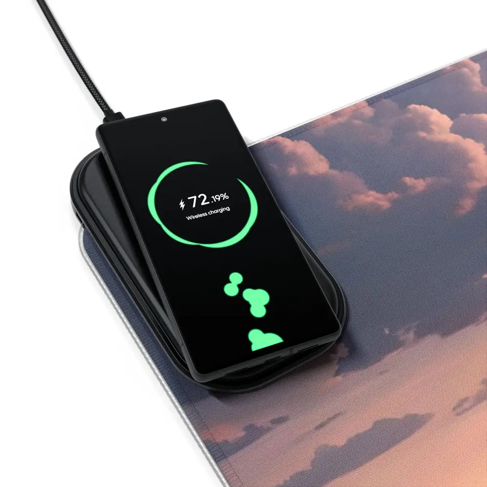 Black smartphone wirelessly charging on RGB Wireless Charging Mousepad The Edge of Dawn