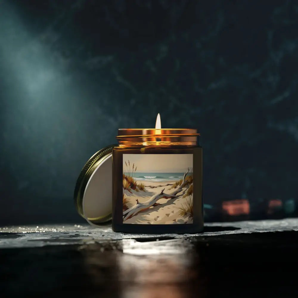 Lit candle with beach scene label from PixiOnyx Coastal Calm Series for relaxation