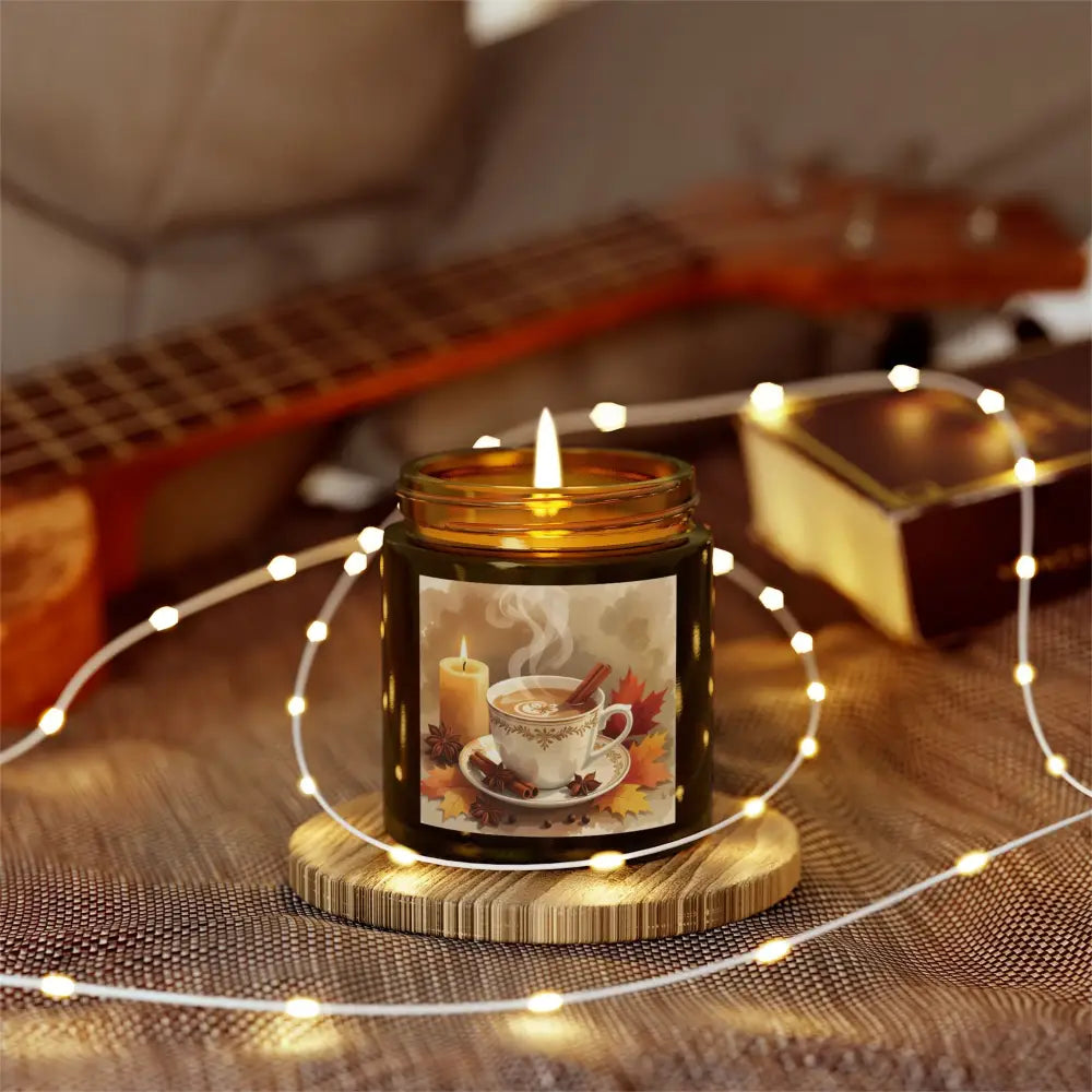 Lit candle with autumn-themed label in PixiOnyx Aromatherapy Cinnamon Chai Blend product