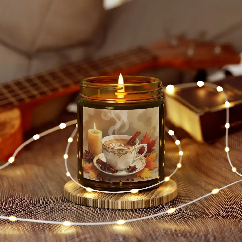 Lit candle with autumn-themed label from PixiOnyx Aromatherapy Accent Cinnamon Chai Blend