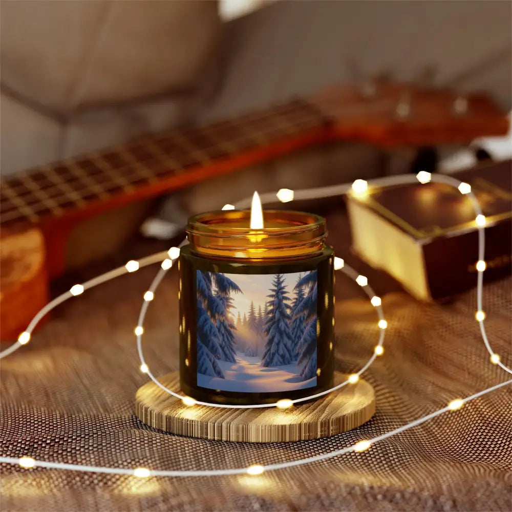 Lit Fraser Fir Candle with winter forest scene creating a cozy winter glow