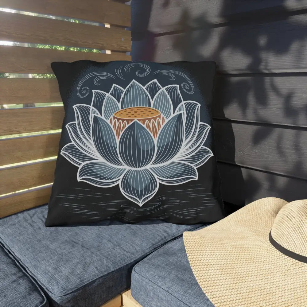 Black square throw pillow with stylized blue and white lotus flower, stunning outdoor pillow
