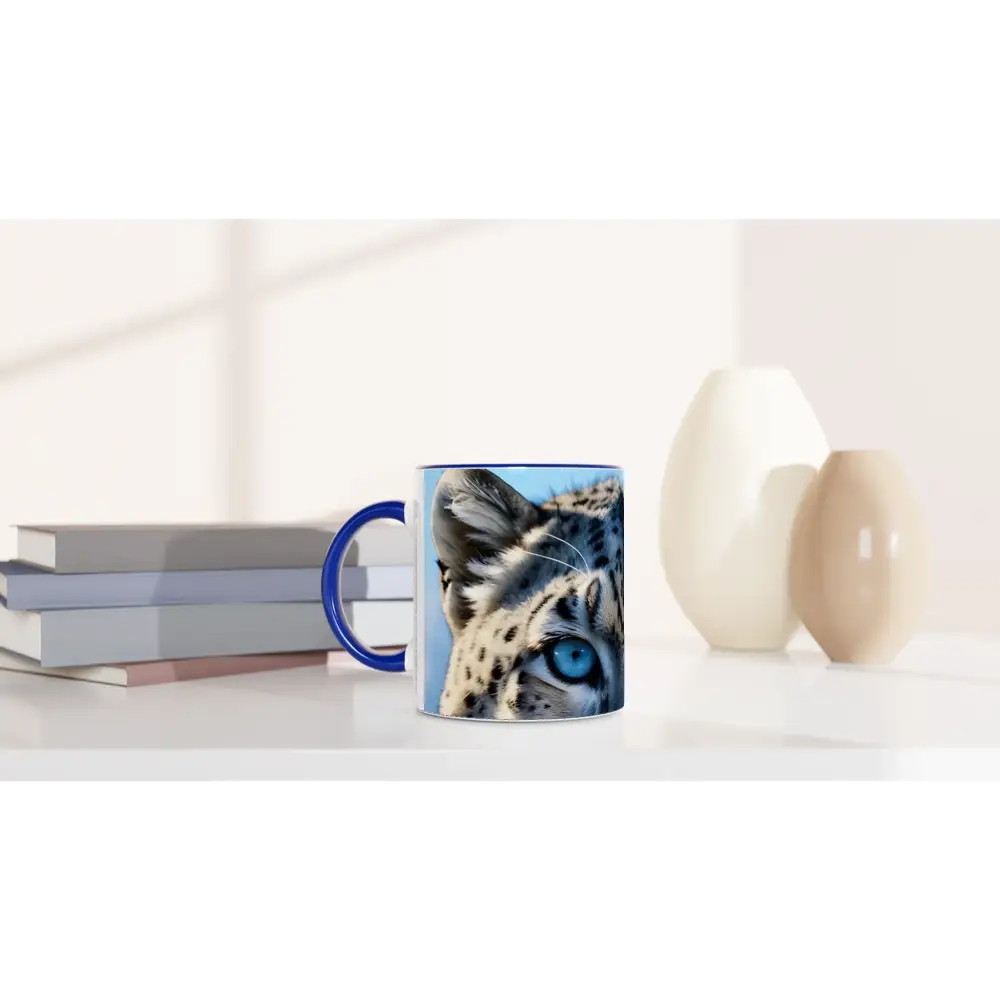 Blue-handled mug with Snow Leopard design from PixiOnyx Glacier Gaze 11oz Ceramic Sipper