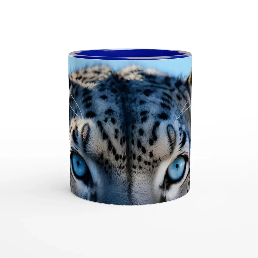Blue-rimmed ceramic mug featuring a snow leopard face in the Snow Leopard Mug Glacier Gaze collection
