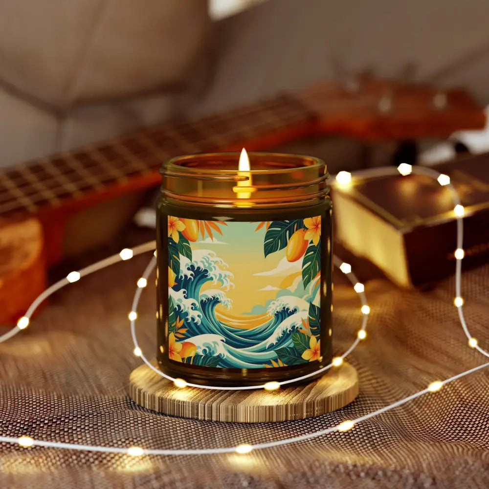 Lit candle with tropical wave design for Mango Coconut Escape aromatherapy jar